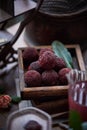 Red bayberry on the table(waxberry), in a building interior with oriental charm, dark environment, dark tone picture