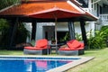 Red beach chairs with red umbrella