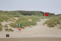 Red beach flag at Camber Sands beach