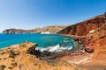 Red beach in Santorini island, Greece. Red volcanic cliffs and the blue sea