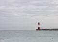 Red beacon on pier