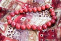 Red bead necklace on a silk scarf Royalty Free Stock Photo