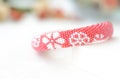 Red beaded bracelet with floral print Royalty Free Stock Photo