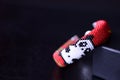 Red beaded bracelet with image of funny panda
