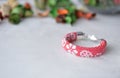 Red beaded crocheted bracelet with floral print Royalty Free Stock Photo