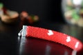 Red beaded I Love You bracelet on a dark background Royalty Free Stock Photo