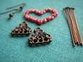 Red beads in form of heart, making of earrings, handmade jewelry Royalty Free Stock Photo