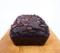 Red bean brownie loaf with chocolate chips on wooden cutting board
