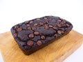 Red bean brownie loaf with chocolate chips on wooden cutting board