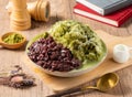 Red Bean Matcha Ice served in bowl isolated on table top view of asian food Royalty Free Stock Photo