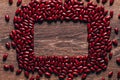 Red beans beautifully laid out on a wooden background. Top view. rectangular copy space. Vegetarian food. Unprepared