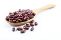 Red beans in a wooden ladle and placed on a white floor, selective focus Royalty Free Stock Photo