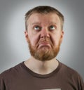 Red-beard man looking up with discontent Royalty Free Stock Photo