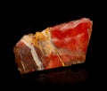 Red beautiful jasper mineral crystal from Orsk, Ural, Russia. A photo of a stone isolated on black. For geology or mineralogy