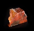 Red beautiful jasper mineral crystal from Orsk, Ural, Russia. A photo of a stone isolated on black. For geology or