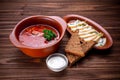 Red beet soup (borsch) with bread and sour cream Royalty Free Stock Photo