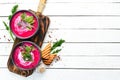 Red beet soup with sour cream. Ukrainian cuisine, Borsch soup. Top view. Free space for your text. Royalty Free Stock Photo