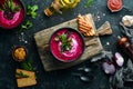 Red beet soup with sour cream. Ukrainian cuisine, Borsch soup. Top view. Free space for your text. Royalty Free Stock Photo