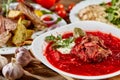 Red beet vegetable soup borscht on wooden background. Ukrainian and russian national food. Close-up. Royalty Free Stock Photo