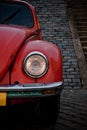 Red beetle front headlight Royalty Free Stock Photo