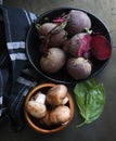 Red beetroot and brown button mushrooms on a dark background Royalty Free Stock Photo