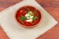 Red beetroot Ukrainian borscht in ceramic bowl on rustic table Royalty Free Stock Photo