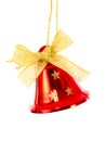 Red bell with golden ribbon brightened