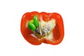 Red bell pepper on a black wooden background, cut in half, isolated on Royalty Free Stock Photo