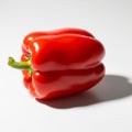 To the right. The pepper is smooth and glossy, with a green stem Royalty Free Stock Photo