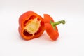 A Red Bell Pepper (Capsicum) cut in half isolated on a white background Royalty Free Stock Photo