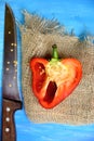 Red bell pepper cut in half knife Royalty Free Stock Photo