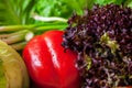 Red bell pepper and green lettuce close-up Royalty Free Stock Photo