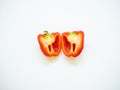 Red bell pepper sliced with seeds isolated in white background Royalty Free Stock Photo