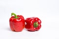Red bell peppers on white wooden table Royalty Free Stock Photo