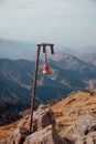 Red bell on the top of Bukreev peak mountain near Almaty in Kazakhstan Royalty Free Stock Photo