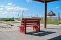 Red bench at the beach Royalty Free Stock Photo