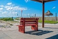 Red bench at the beach Royalty Free Stock Photo