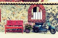 Red bench with flowers and motorcycle Royalty Free Stock Photo