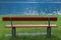 Red bench at lake shore Royalty Free Stock Photo