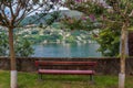 Red Bench Overlooking Lake Lugano in Switzerland Royalty Free Stock Photo