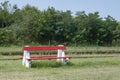 Red bench and yellow flowers at a rural train station in Eastern Royalty Free Stock Photo