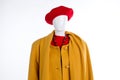 Red beret and yellow coat for women. Royalty Free Stock Photo