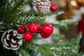 Red berries and frosted pine cones on a christmas tree Royalty Free Stock Photo