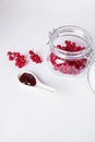 Red berries with glass jar and jam Royalty Free Stock Photo