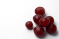 Red berries of grapes close-up on a white background Royalty Free Stock Photo