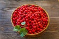 Red berries of hawthorn in the basket standing on a wooden table. Copy space Royalty Free Stock Photo