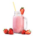 Red berries are lying in front of a glass jar filled with natural smoothie with a colorful straw, isolated on a white background.