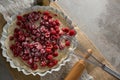 Red berries on tart with whisker and rolling pin Royalty Free Stock Photo