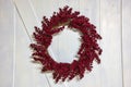 Red Berry Grapevine Wreath on Barn Door Royalty Free Stock Photo