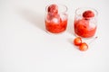 Red berry lemonade in glass jar on a wooden background with lemon slices, honey and ice. Top view Royalty Free Stock Photo